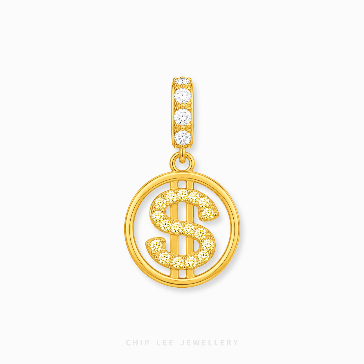A gold pendant featuring a circular openwork design with a dollar sign motif, embellished with small clear stones, and a top bail with four clear stones, shown on a light gray background.
