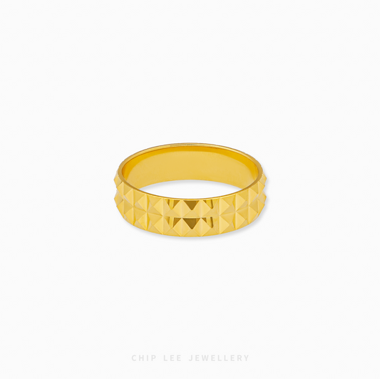 Pyramid ring with geometric design in polished gold metal