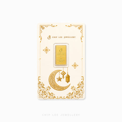 A gold-plated rectangular chip card with decorative gold floral borders and a crescent moon, star, and lantern illustration, featuring a small central clear window holding a gold bar. The card is branded CHIP LEE JEWELLERY.