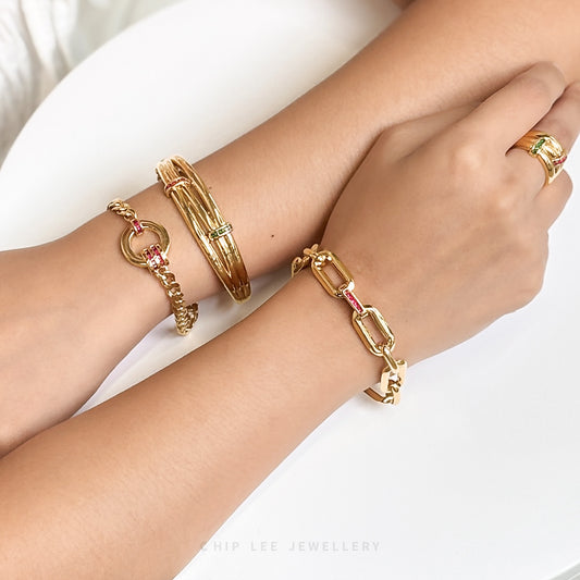 916 gold link bracelet with red cubic zirconia. Hallmarked by Singapore Assay Office for certified purity and authenticity.