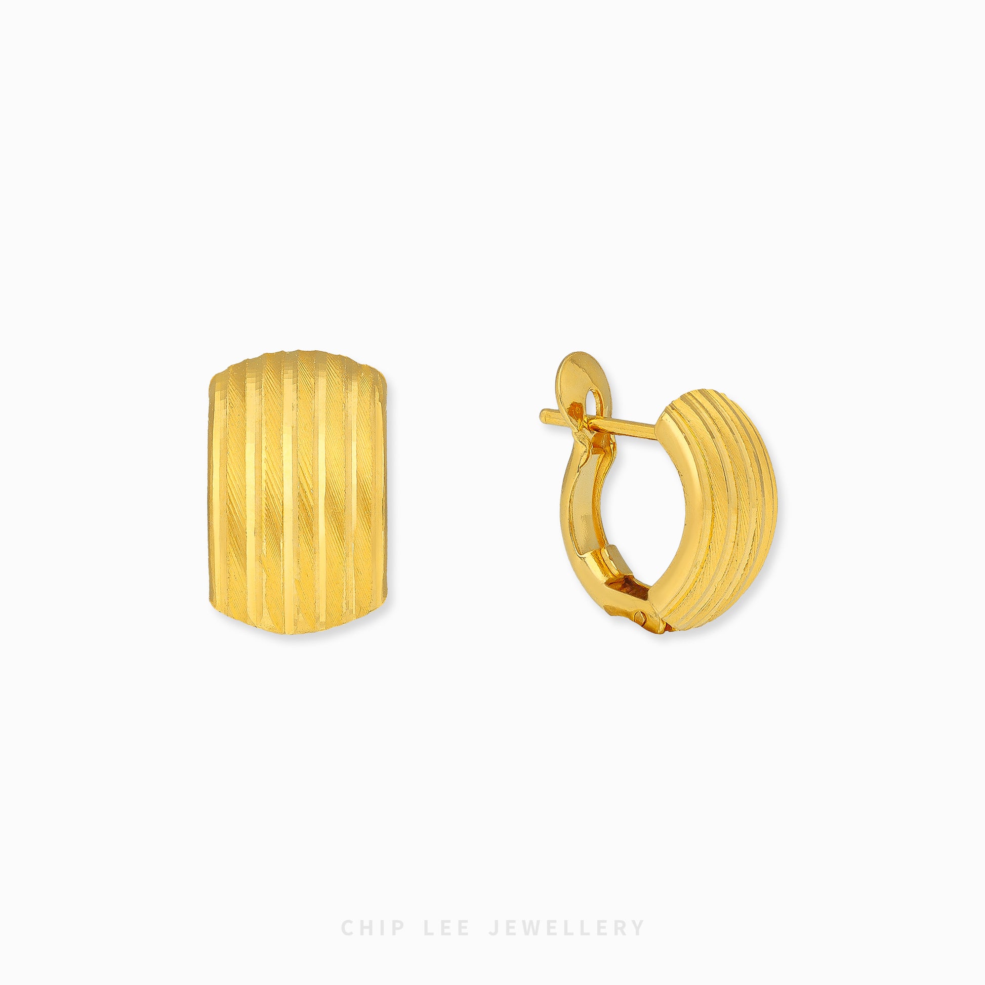 Ribbed hoop earrings with textured ridged detailing and polished gold finish.