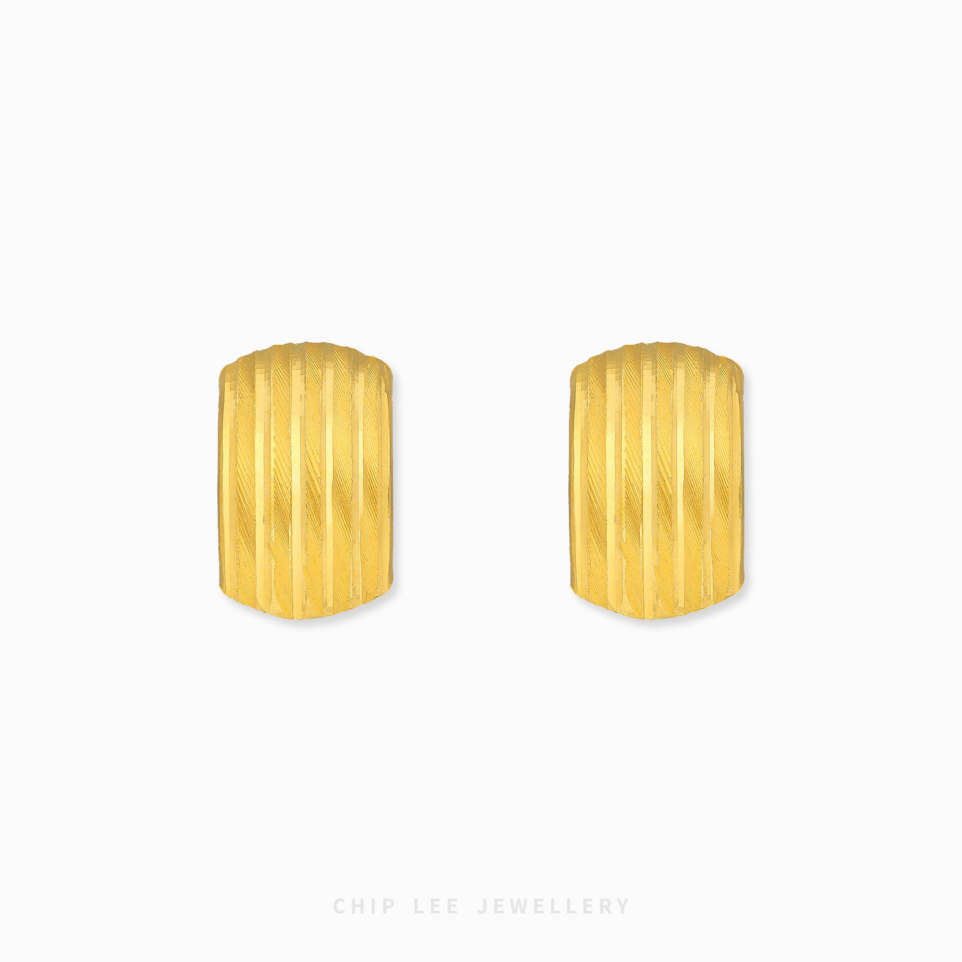 Ribbed hoop earrings with textured ridged detailing and polished gold finish.