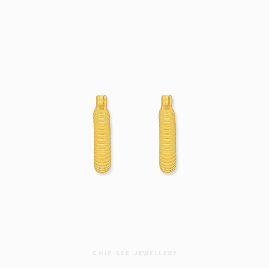 Chip Lee Jewellery Singapore Ribbed Hoop Earrings 916 Gold for women. Contemporary textured gold hoops. Elegant daily wear accessory.