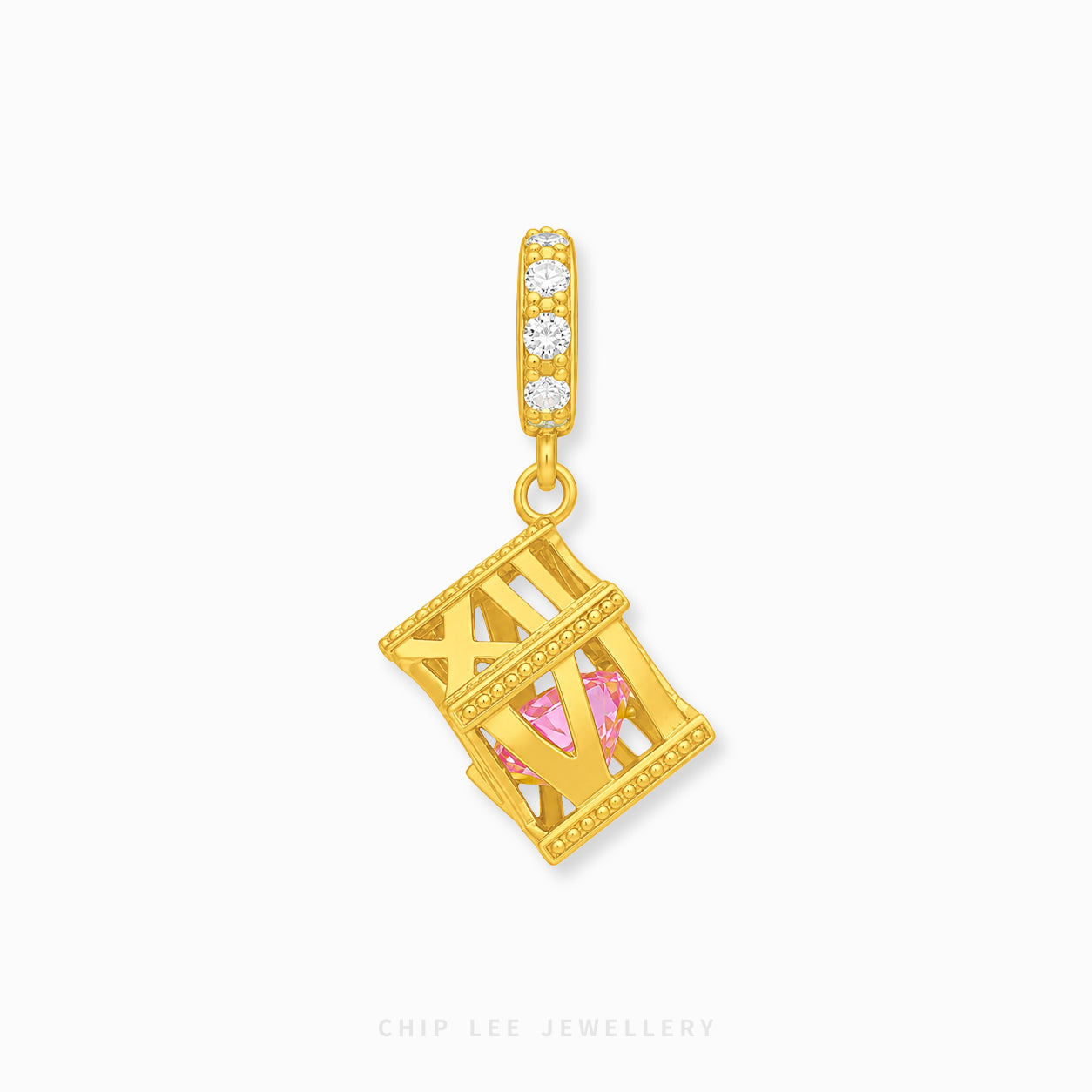 A gold-plated cylindrical charm with three clear stones and a dangling geometric cage pendant containing a pink gemstone, shown on a light gray background with Chip Lee Jewellery branding at the bottom.