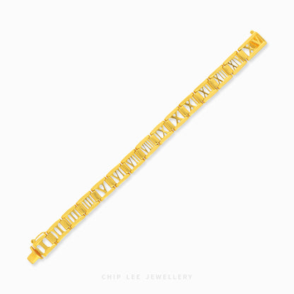 Gold Roman numerals bracelet featuring polished link detailing and an elegant luxury statement design.