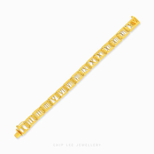 Gold Roman numerals bracelet featuring polished link detailing and an elegant luxury statement design.