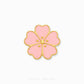 A pink cherry blossom flower-shaped charm with gold metal borders and three small gold dots in the center, shown on a plain white background with Chip Lee Jewellery branding at the bottom.