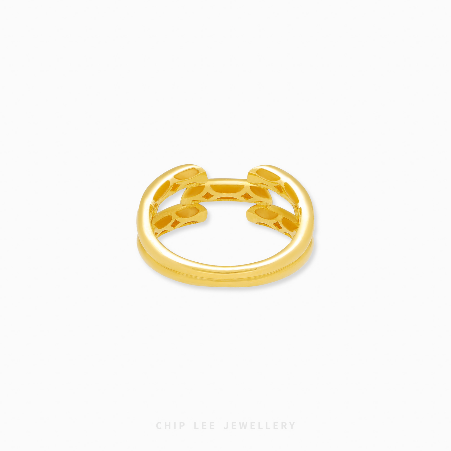 Gold ring with a unique design on a white background
