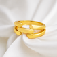 Gold ring on a white fabric background with 'Chop Lee Jewellery' branding.