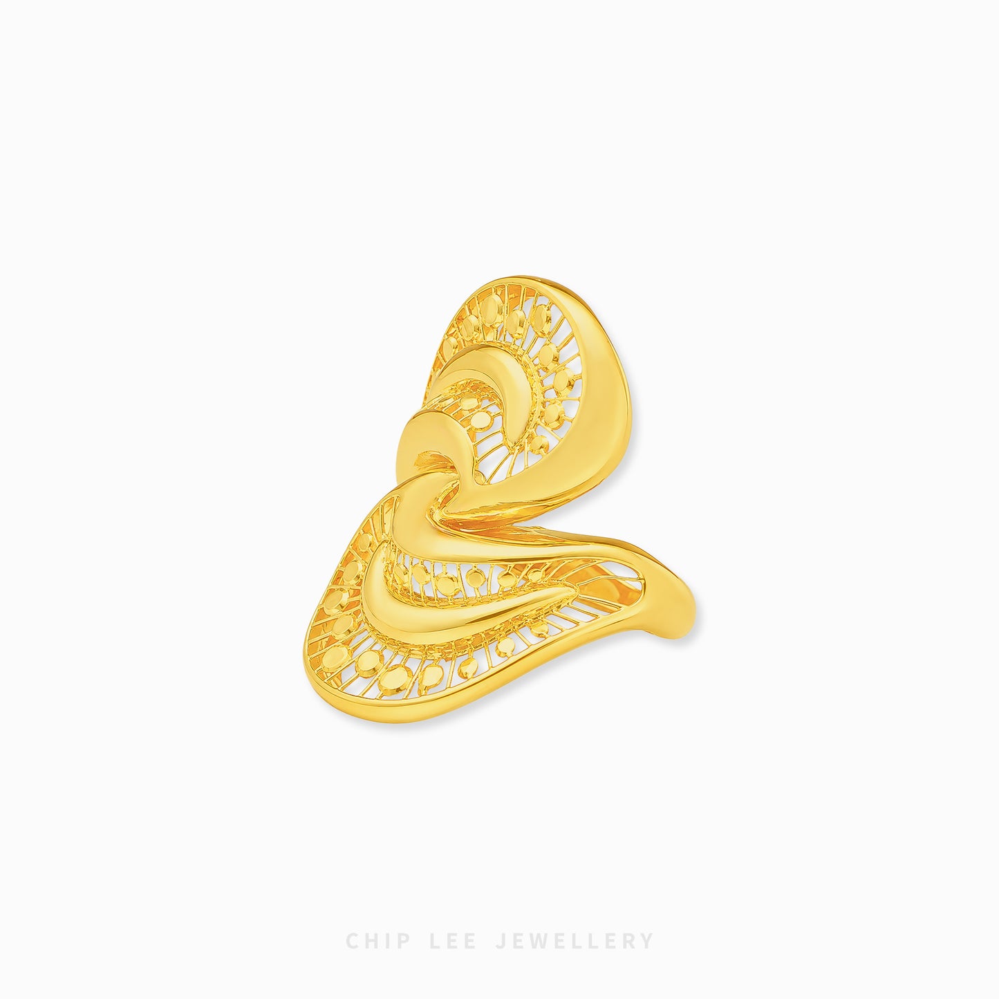 A gold filigree ring with an abstract, flowing organic shape, displayed on a clean white background with a brand watermark at the bottom.