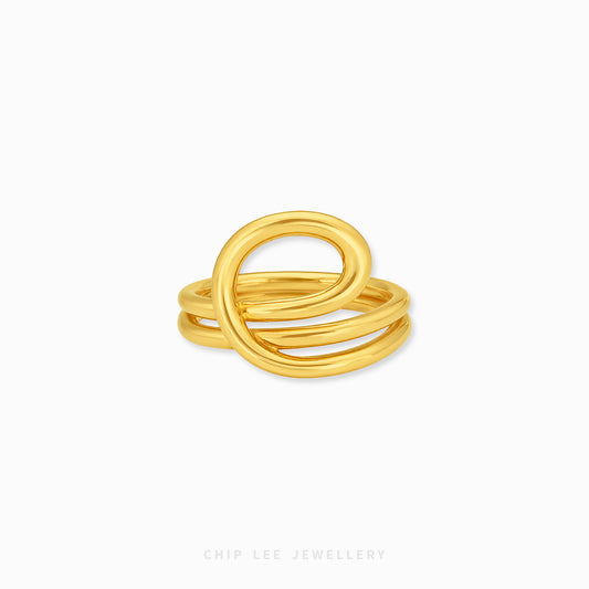 close-up 22K gold abstract loop ring with polished finish