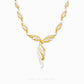 916 gold Seraphina wing design necklace with two-tone curved links and cascading wing-inspired centrepiece