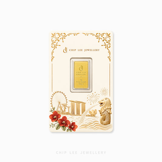A gold bar presented on a decorative cream card from Chip Lee Jewellery, with ornate gold border details and illustrations including a Ferris wheel, temple, fireworks, and a merlion. The card is centered on a light gray background.