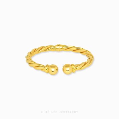 Spiral Cuff Bangle by Chip Lee Jewellery Singapore, 916 gold modern spiral silhouette, fluid lines and elegant standout wrist accessory