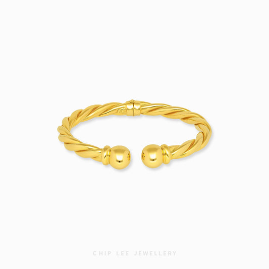 Spiral Cuff Bangle by Chip Lee Jewellery Singapore, 916 gold modern spiral silhouette, fluid lines and elegant standout wrist accessory