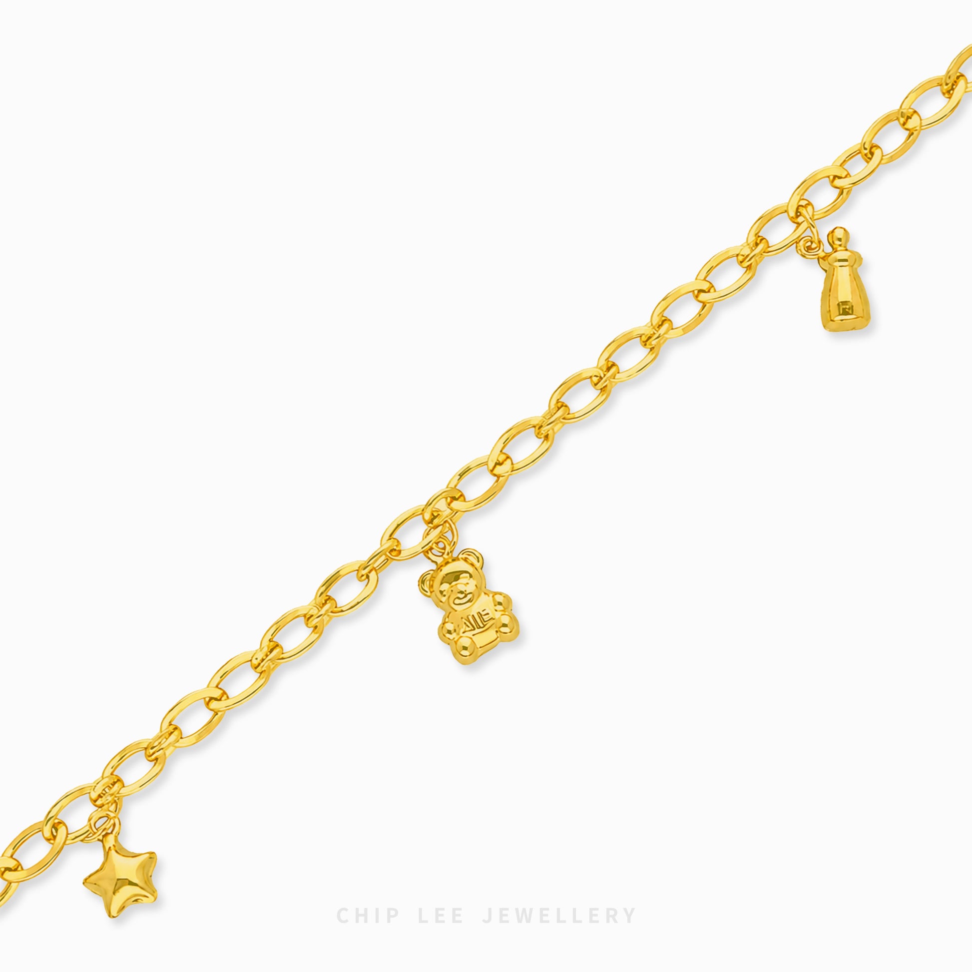 A gold chain bracelet with dangling charms, including a teddy bear, a star, and a small lantern, shown on a clean white background with the brand name 'CHIP LEE JEWELLERY' at the bottom.