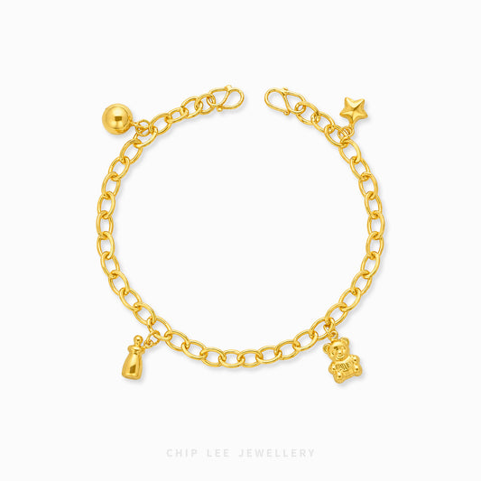 A gold chain anklet with small charms, including a teddy bear, a bottle, a star, and a ball, displayed on a clean white background with the brand name 'CHIP LEE JEWELLERY' at the bottom.