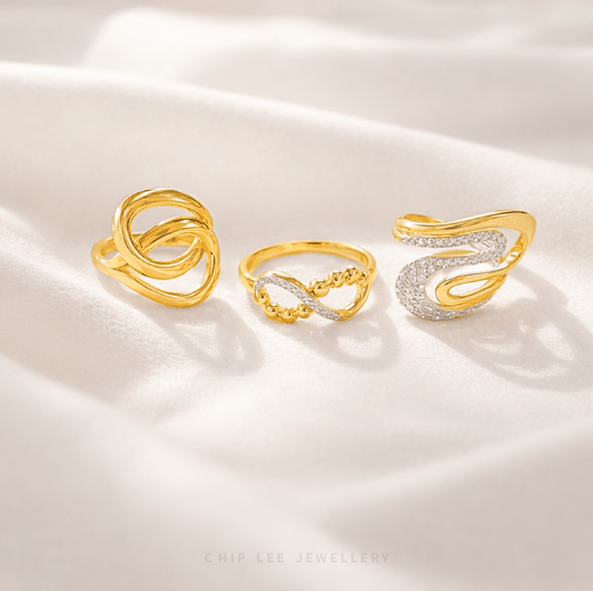 Three gold and silver rings on a white satin background, with 'Chip Lee Jewellery' branding.