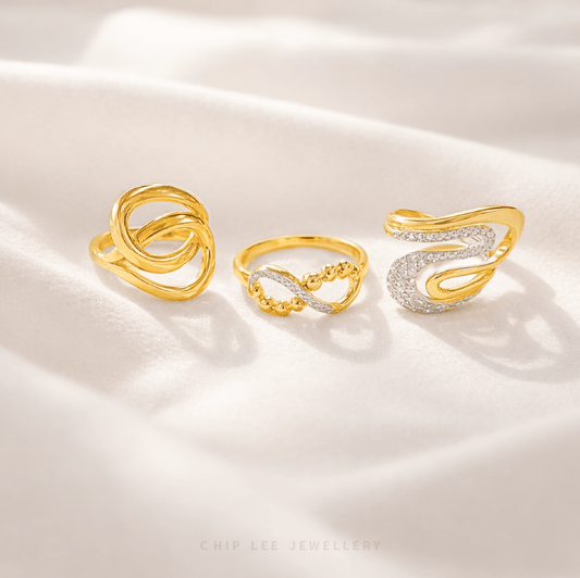 Three gold and silver rings on a white satin background, with 'Chip Lee Jewellery' branding.