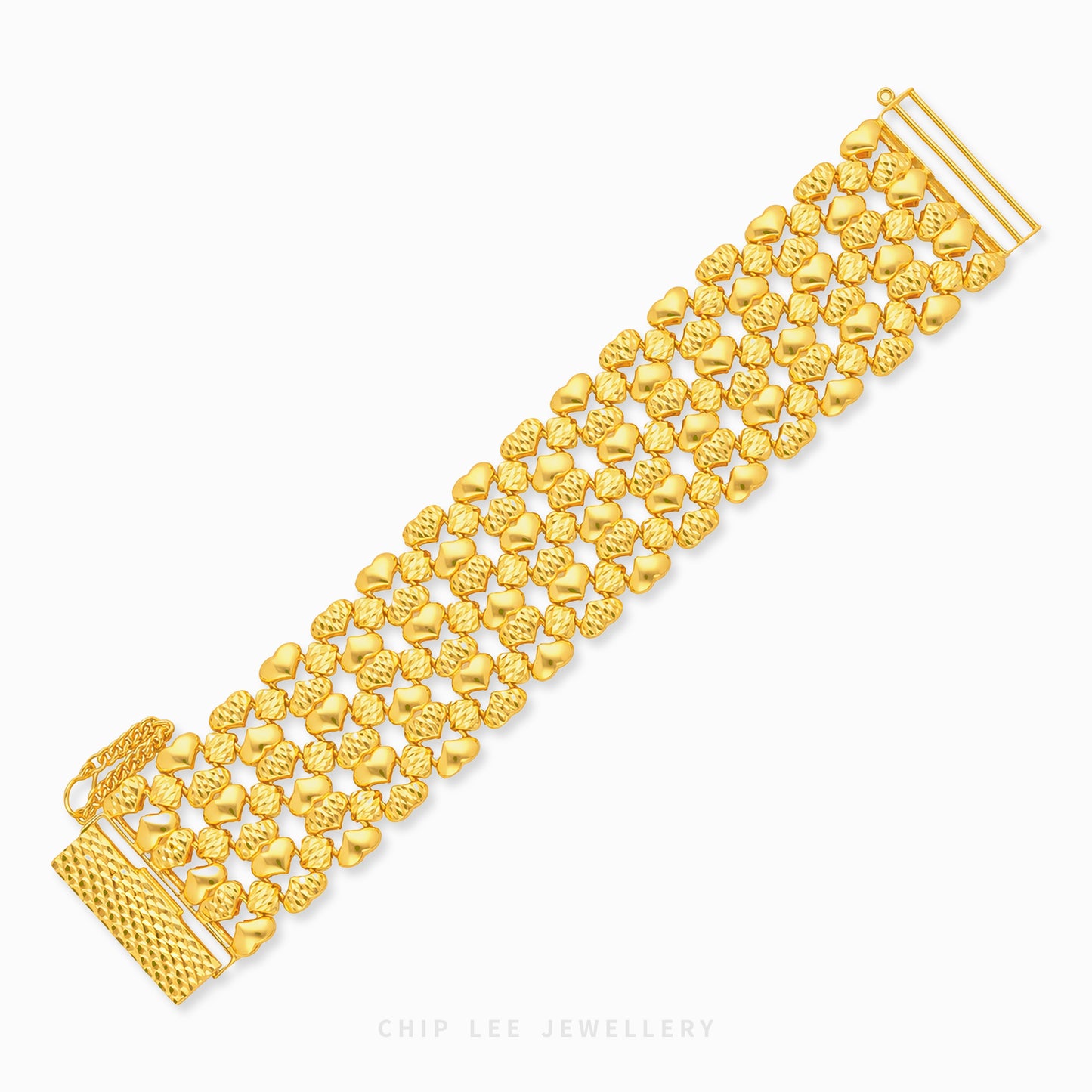 A gold multi-strand bracelet with textured and polished heart-shaped links, displayed diagonally on a clean white background with a brand watermark at the bottom.