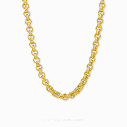 Gold chain necklace on a white background