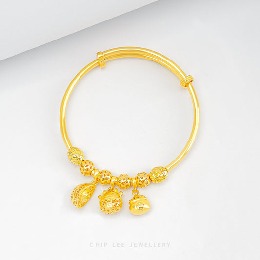 Triple Prosperity Baby Bangle in 916 gold by Chip Lee Jewellery, an elegant keepsake symbolizing luck, heritage and graceful charm for your child.