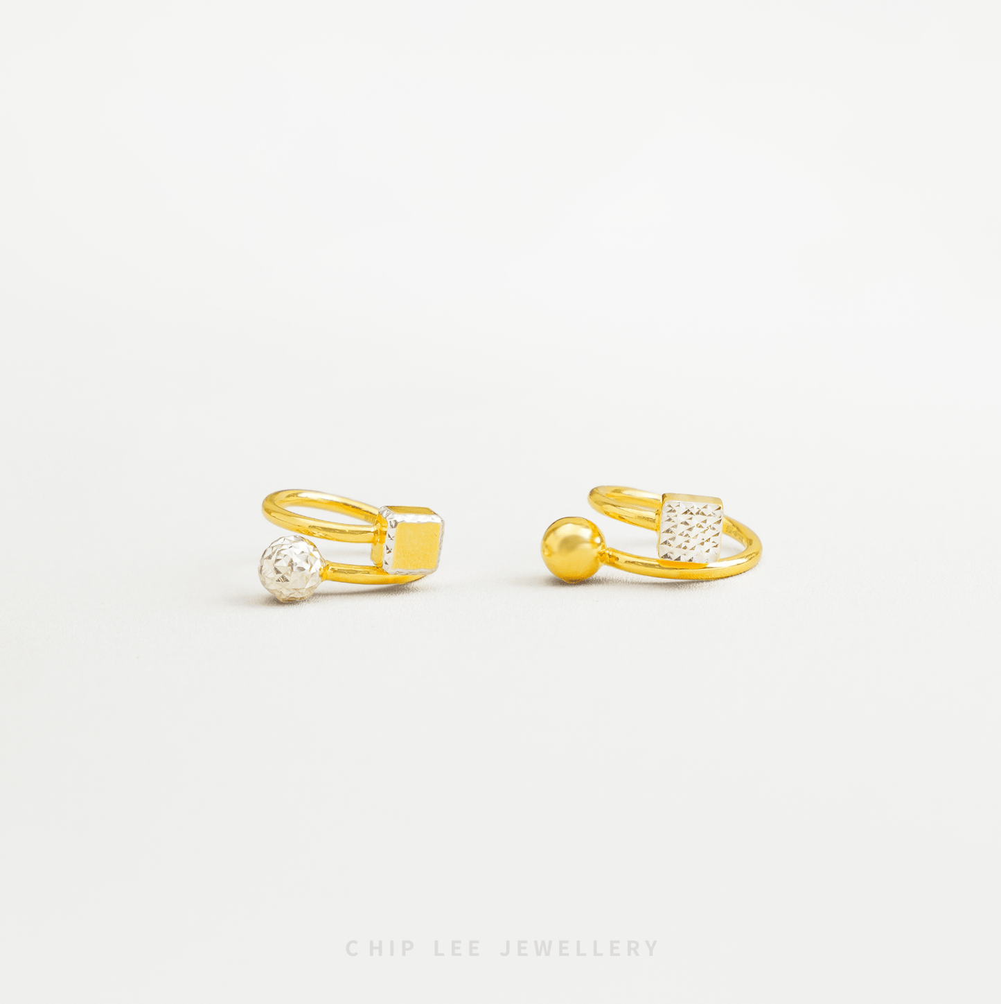 Gold open-knit ring with spherical embellishments on a white background, branded 'Chop Lee Jewellery'.