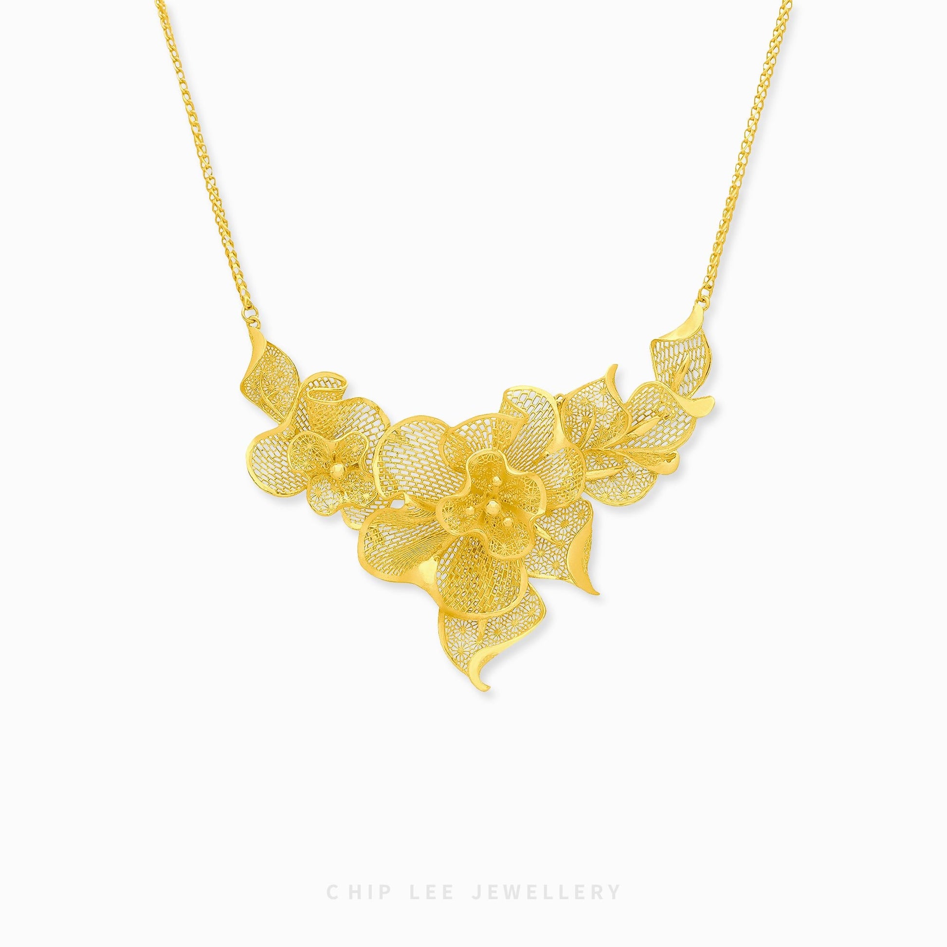 999 24K Gold Flora Necklace featuring delicate floral details in pure gold, designed for timeless elegance and effortless daily sophistication.