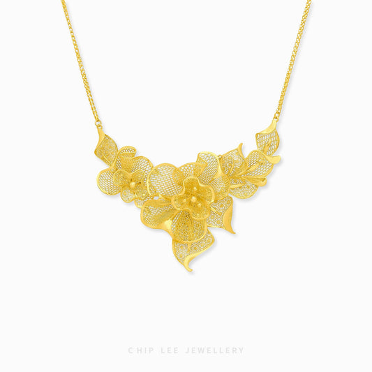 999 24K Gold Flora Necklace featuring delicate floral details in pure gold, designed for timeless elegance and effortless daily sophistication.