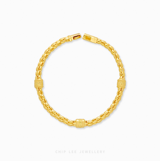 Gold bracelet on a white background with 'Chic Lee Jewellery' branding.