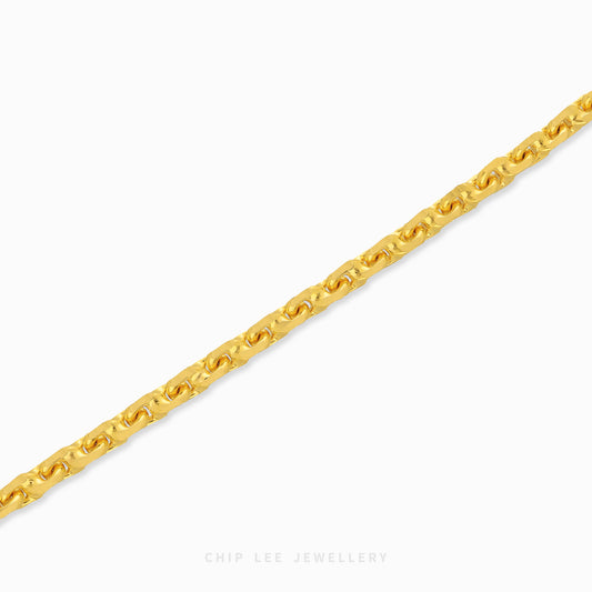 Textured gold chain bracelet with organic interlocking links and clasp closure.
