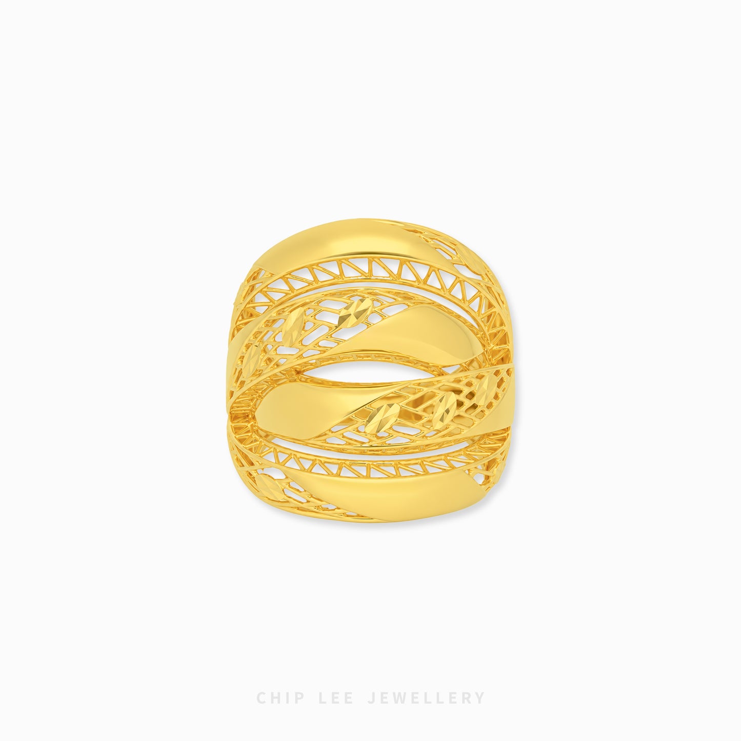 A gold ring with an intricate, openwork filigree design and a central floral motif, shown on a clean white background with a brand watermark at the bottom.