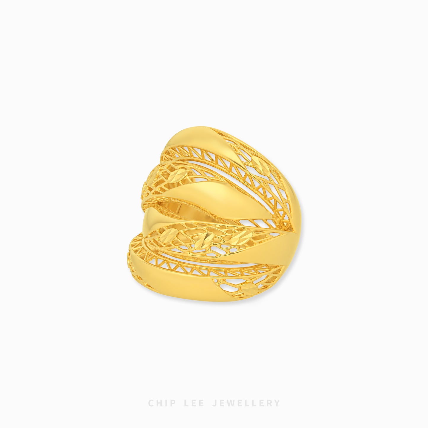 A gold filigree wrap ring by Chip Lee Jewellery, featuring an intricate openwork design with a polished central band, shown on a clean white background.