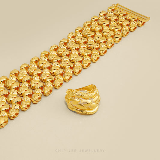 Gold jewelry set featuring a chunky textured chain bracelet and a matching knotted ring, displayed on a neutral beige background with the brand name 'CHIP LEE JEWELLERY' at the bottom.